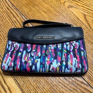 Vera Bradley wallet.  Blue print with black flap and strap.  Strap damage.